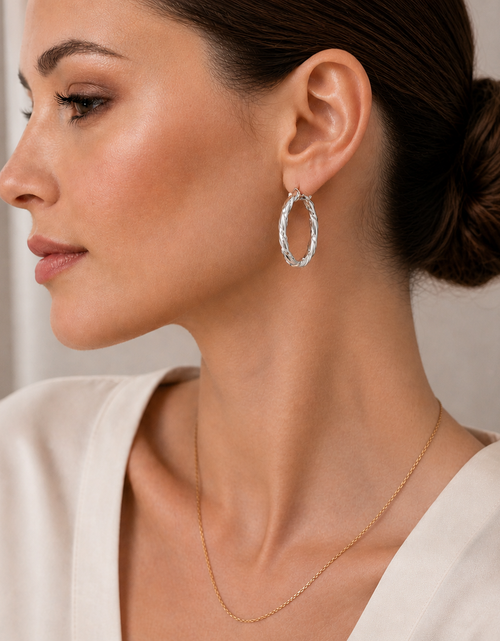Load image into Gallery viewer, Simply Savvy “Twisted Radiance” Dobbs Sterling Silver Hoop Earrings
